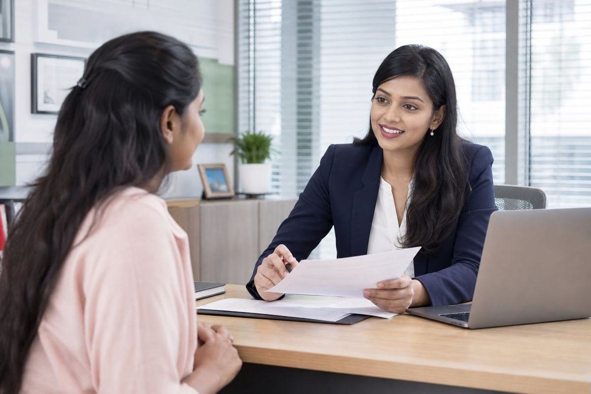 CoverBima advisor explaining a policy to a client
